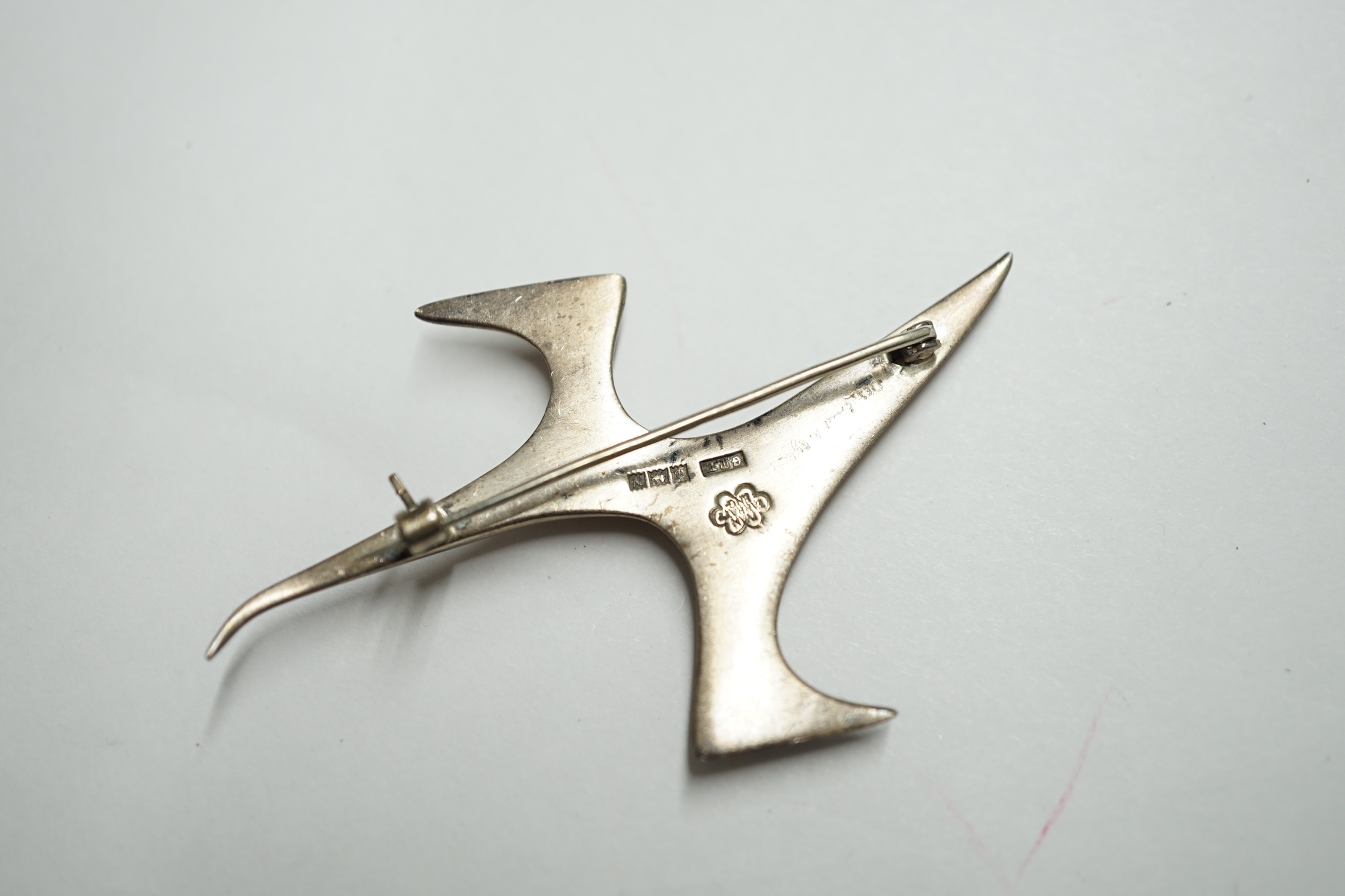 A 1950's Ivan Tarratt modernist silver 'Flight' abstract brooch, Birmingham 1962, designed by Ernest A. Blyth, facsimile signature, 66mm. Condition - fair